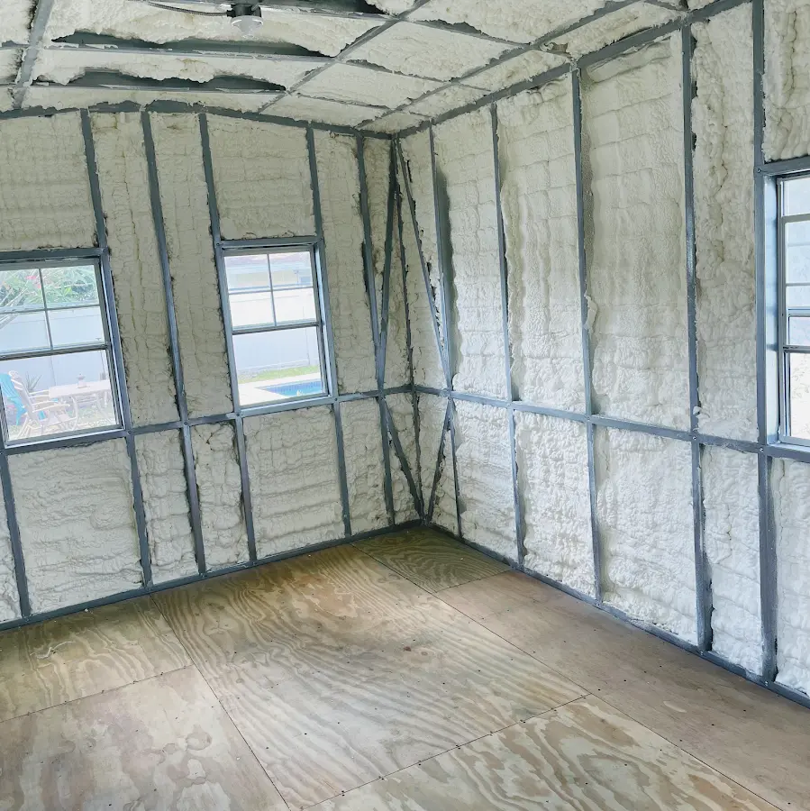 Closed-cell spray foam insulation applied to wall cavities in a residential project in Williston Park