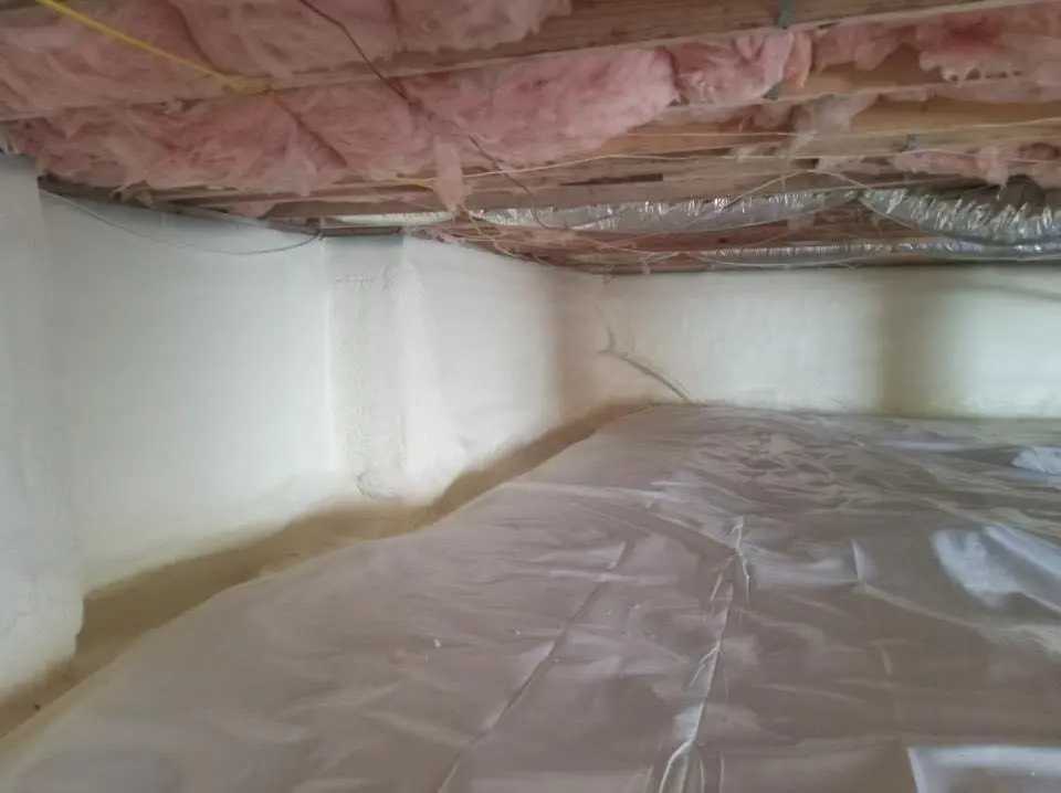 Crawl space encapsulation with closed-cell spray foam for Commercial Roof Restoration in Williston Park